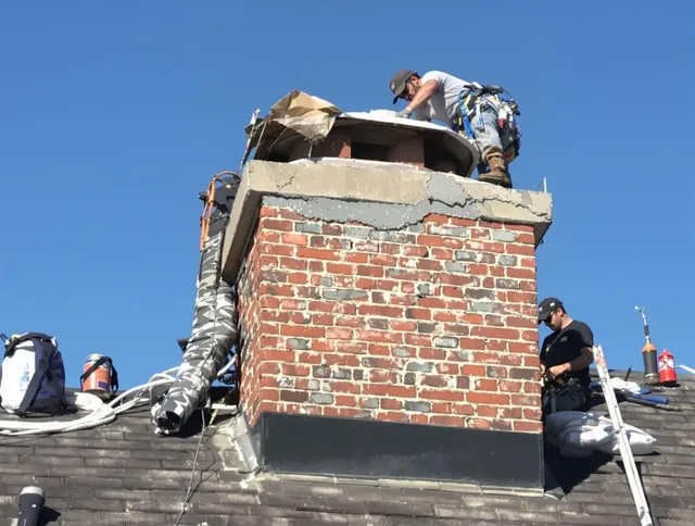 Lauderhill Chimney Sweep installing a custom chimney crown in Lauderhill, FL