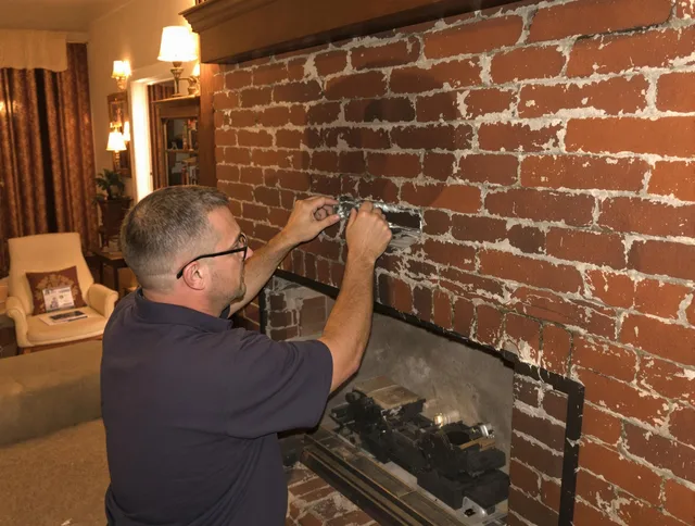 Lauderhill Chimney Sweep expert fixing a fireplace in Lauderhill, FL